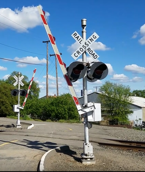 railroad crossing signals flashing